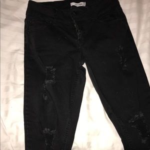 Black distressed jeans.